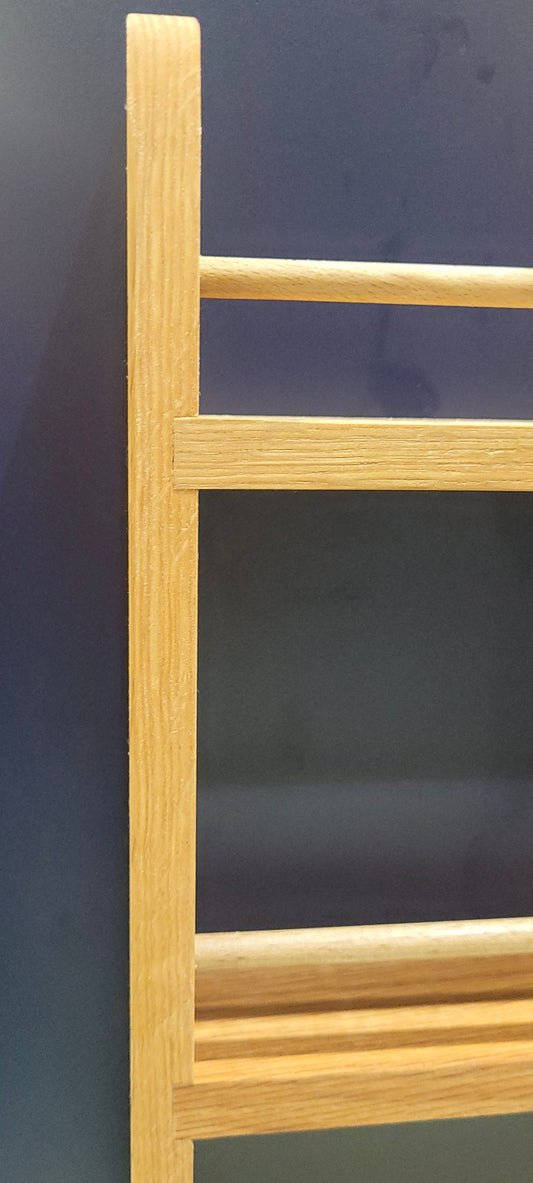 Closeup of 3 shelf solid oak spice rack for cupboard door hanging