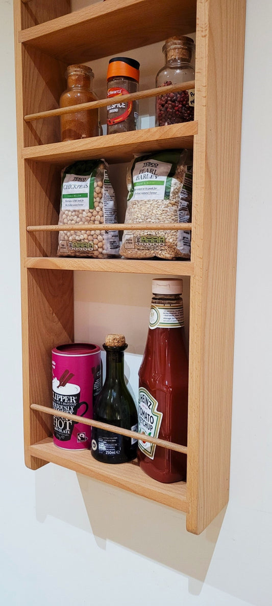 Closeup of bottle shelf on Beech larder rack