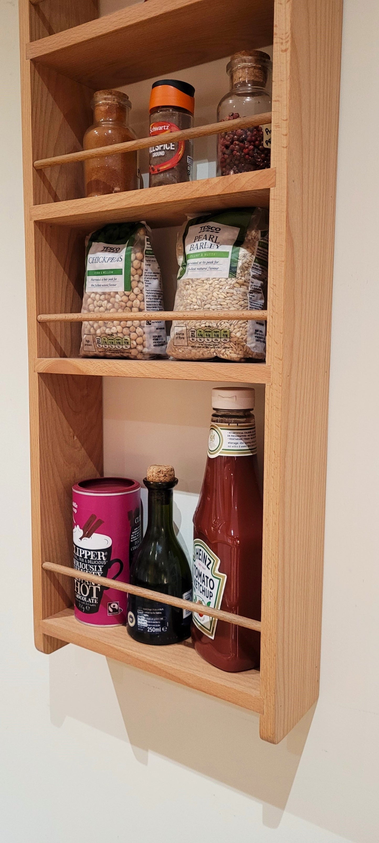 Close up of bottle shelf on 5 shelf butlers pantry larder rack