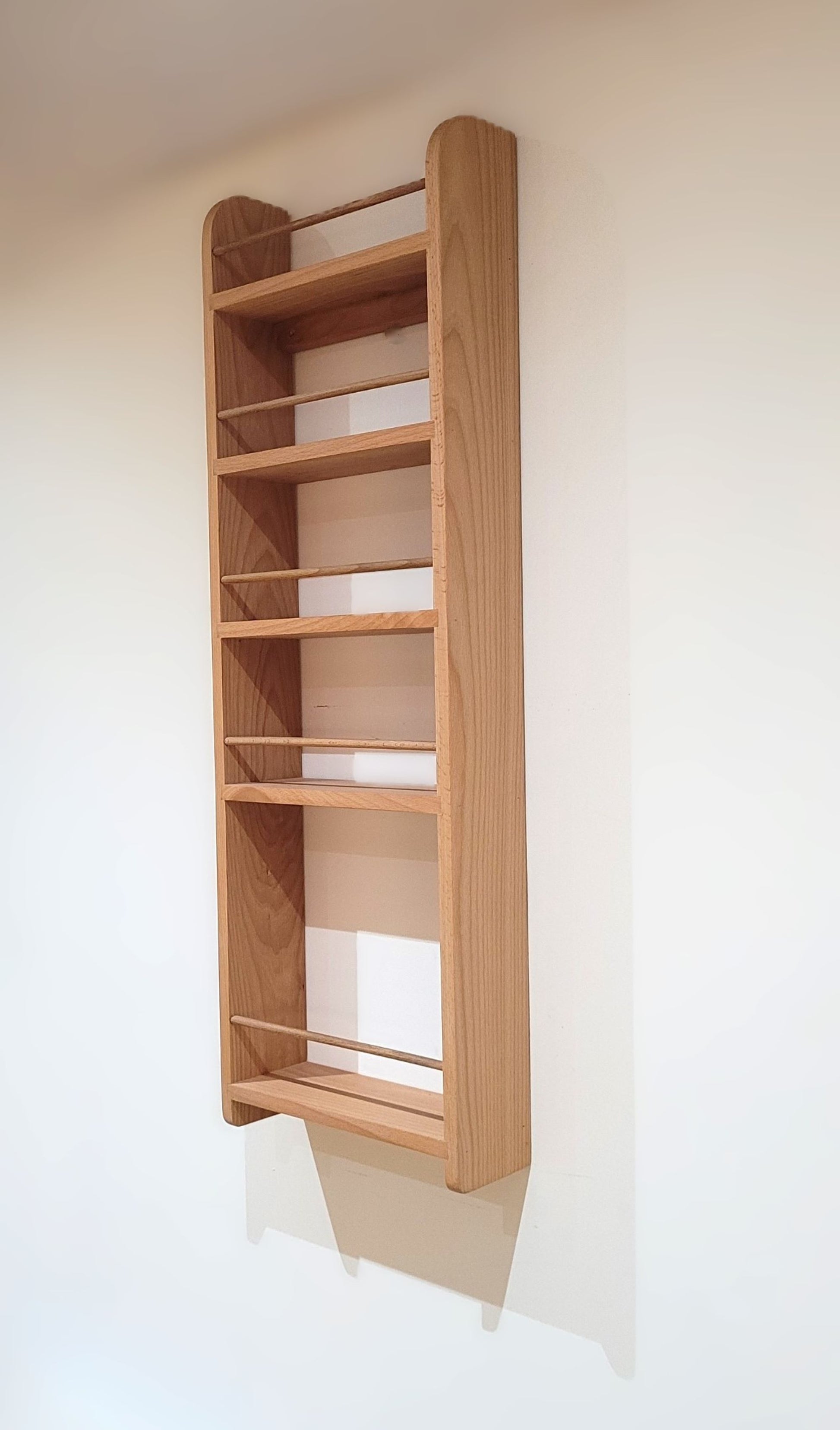 Empty solid beech butler pantrylarder rack with 4 spice shelves and a bottle shelf