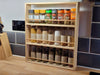 Solid Pine Spice Rack 3 Shelf with a range of spice jars and herb jars