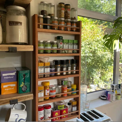 Solid oak 5 shelf spice rack with lots of spice and herb jars